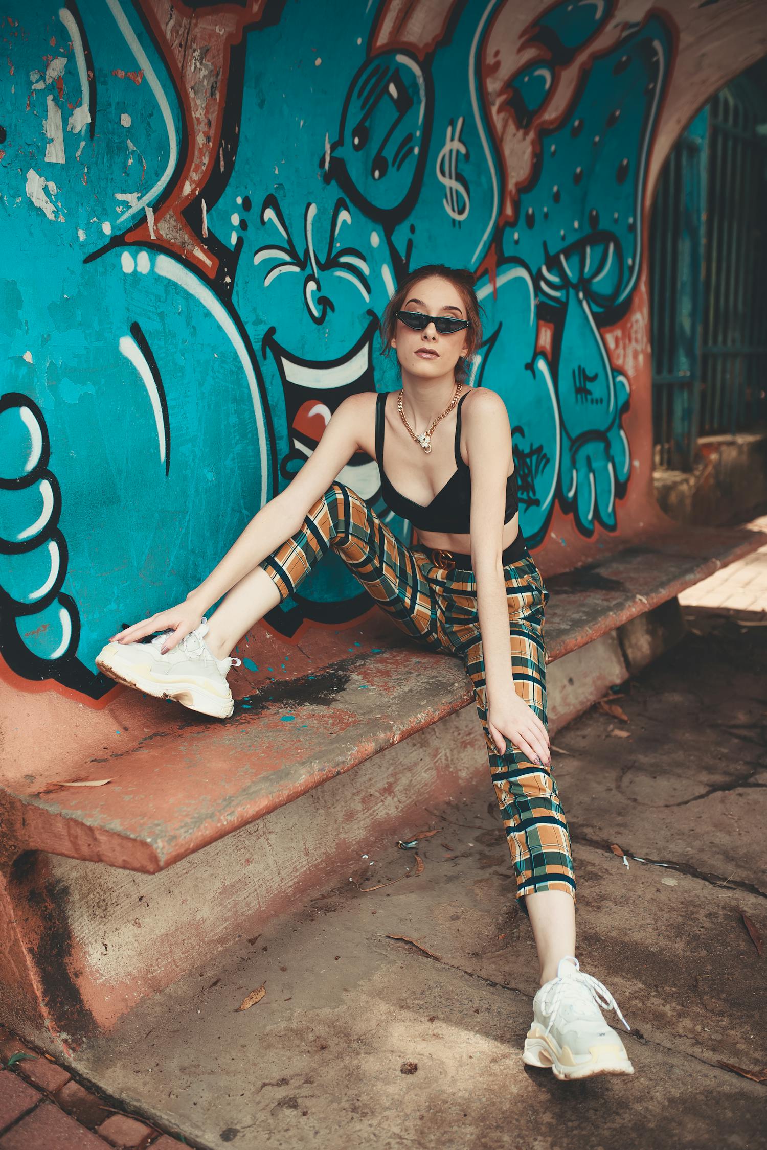 Woman With Right Leg on Bench and Left Leg on Floor Wearing Black Bra ...