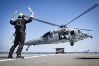 Man in Front of Helicopter