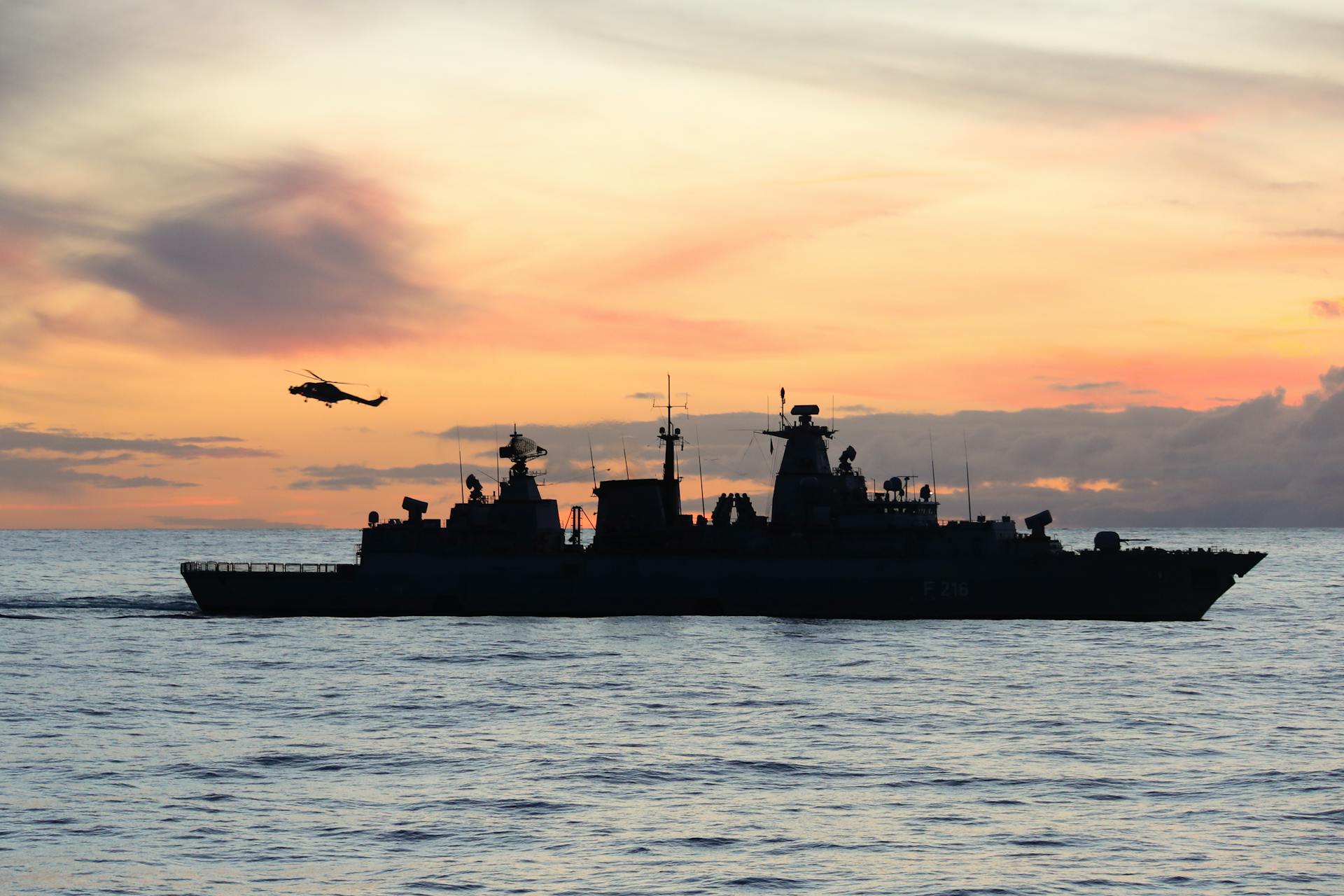 Silhouette of Warship on the Sea