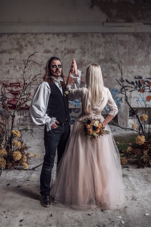 Couple Dressed in Bride and Groom Halloween Costumes 