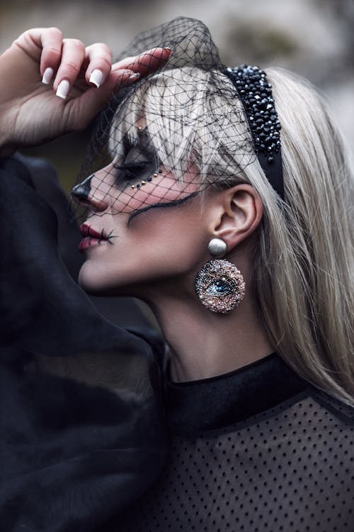 Model with Painted Face for Halloween and in Veil