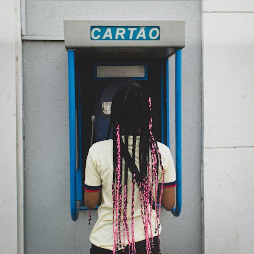 Woman Standing by ATM