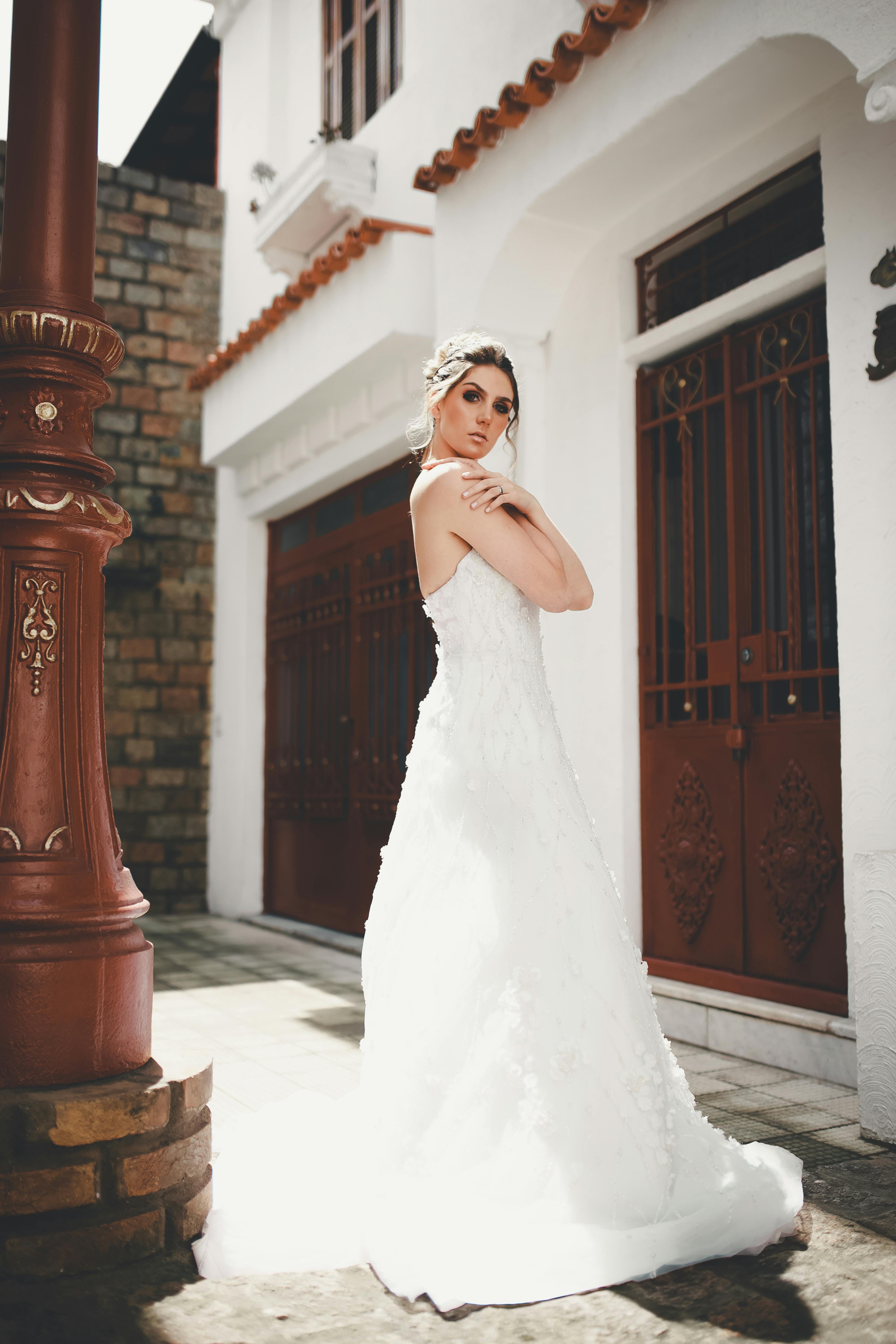 Blue Haired Woman in White Lace Wedding Dress Lying on 