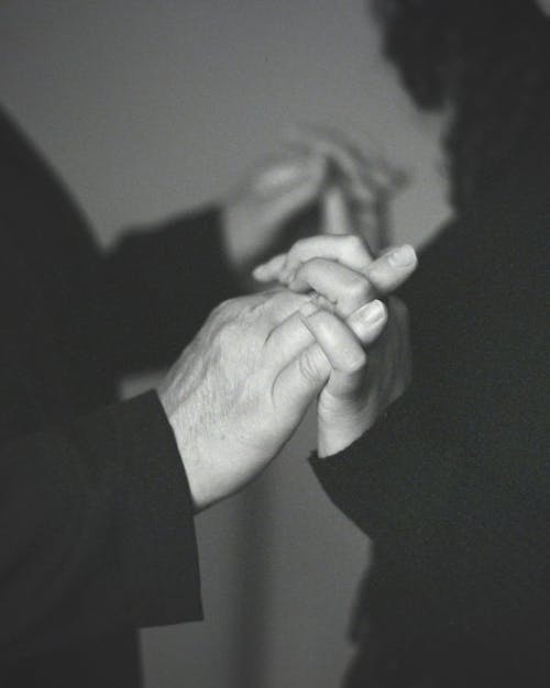 Man and Woman are Holding their Hands