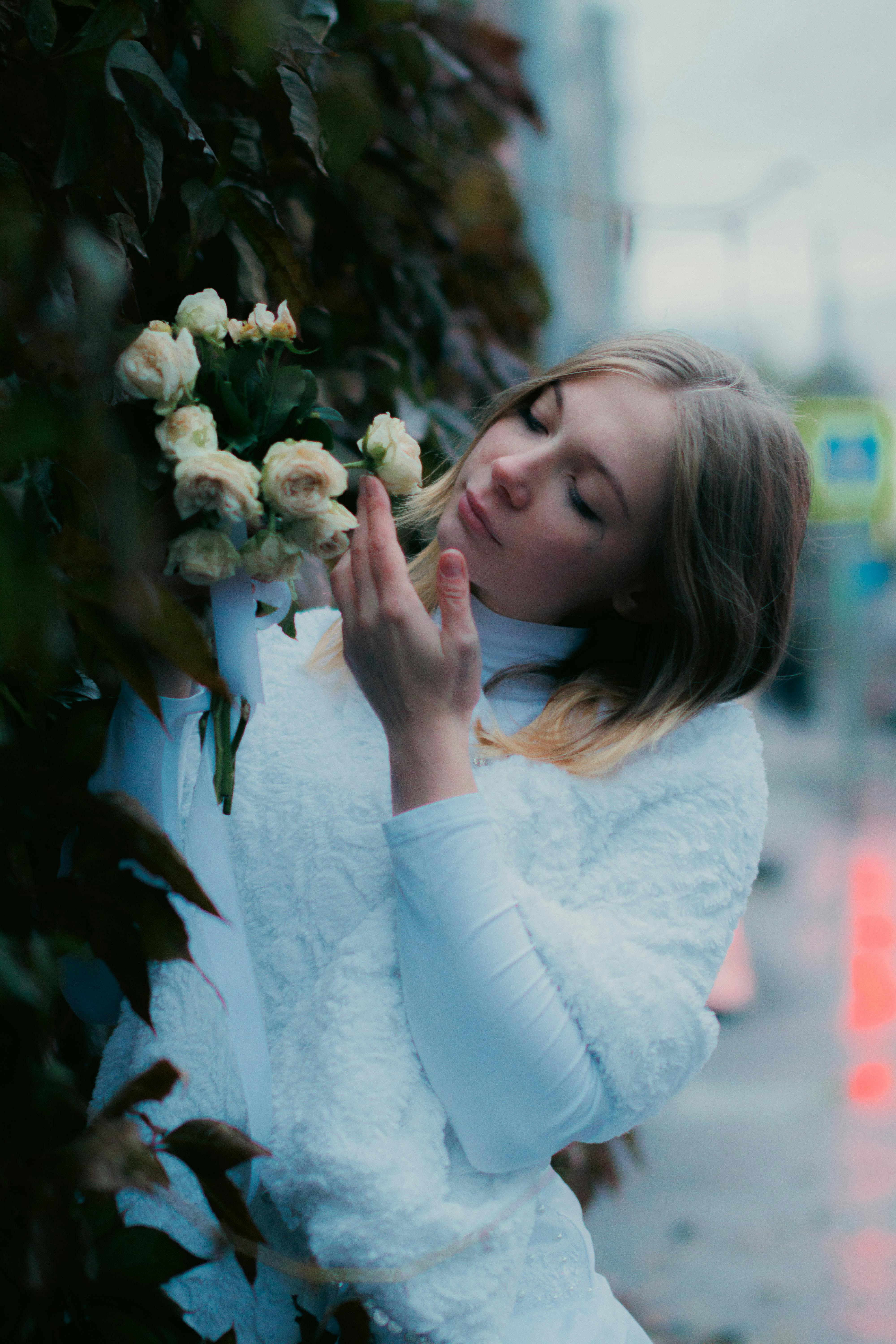Woman Touching Roses · Free Stock Photo