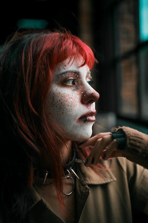 Woman with Painted Face and Red, Dyed Hair