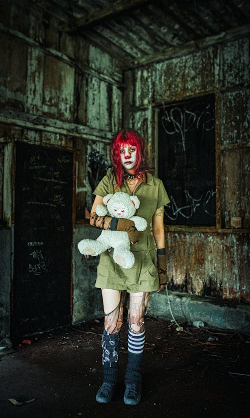 Woman in Spooky Costume for Halloween in Decaying Interior