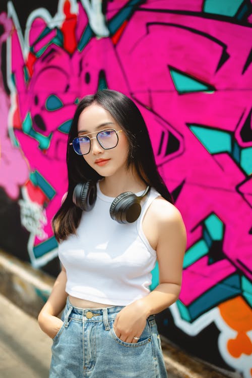 Portrait of Woman in Eyeglasses and Headphones