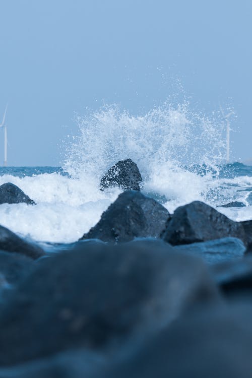 Wave Crashing over Rocks 