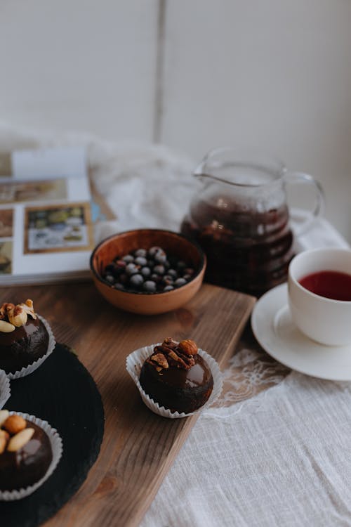 Still Life with Chocolate Cupcakes an a Bowl of Blueberries