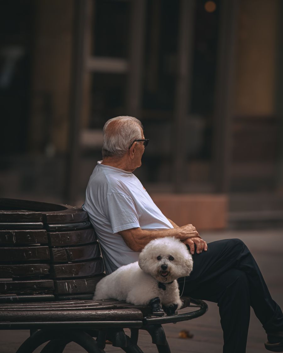 An older man with his dog