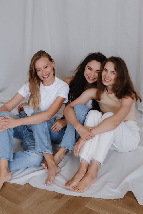 Smiling Women Sitting Together