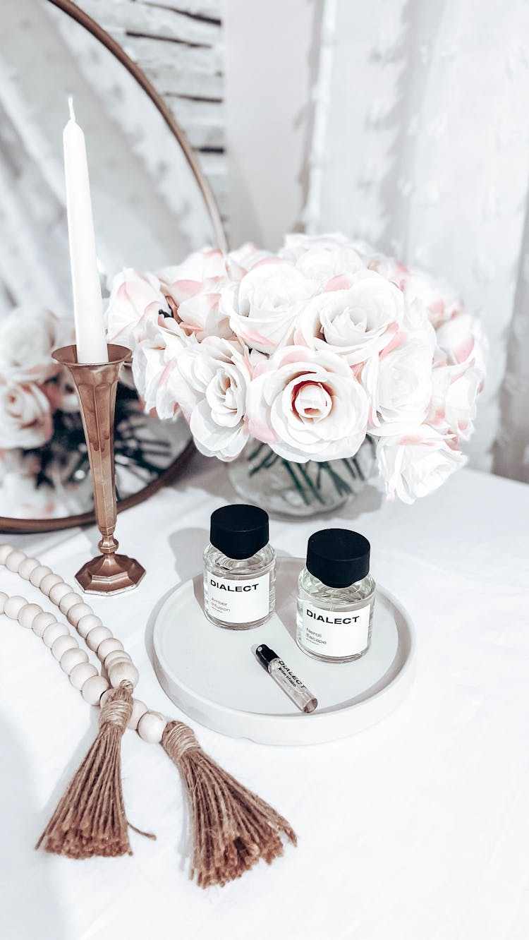 Bouquet Of Roses And Fragrances On A Table 