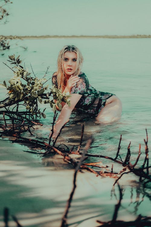 Blonde Woman Posing in a Lake 