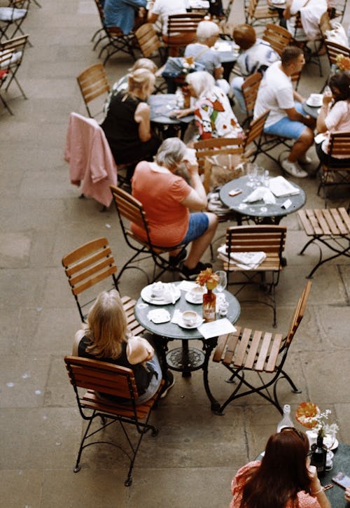 People Dining in Front of a Restaurant 