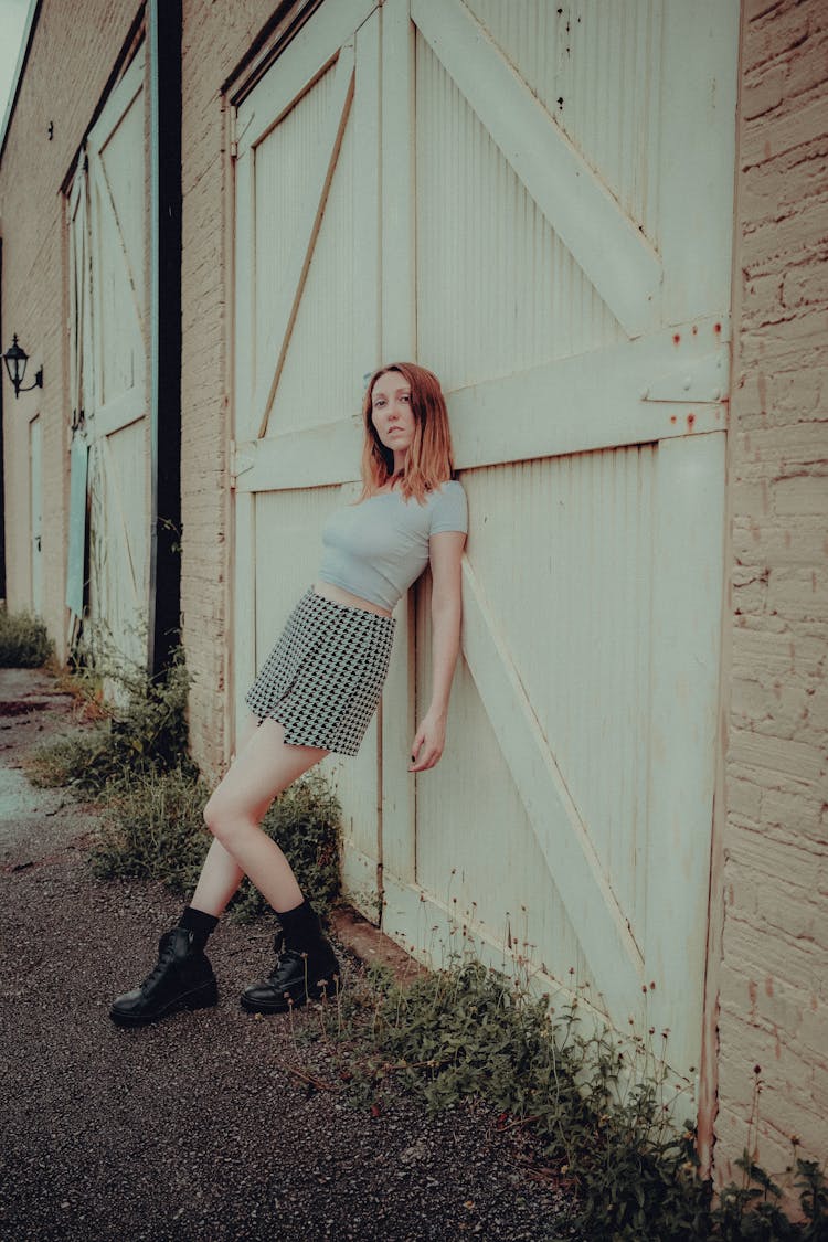 Girl Leaning On The Gate 