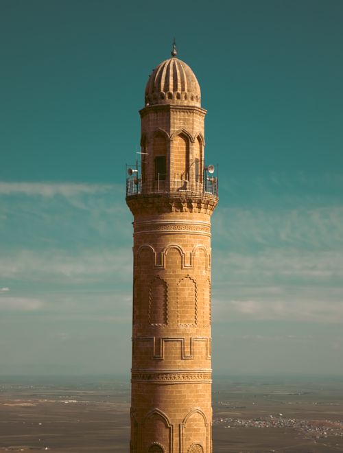 Free A tall, historic minaret against the sky in Mardin, Turkey, showcasing Islamic architecture. Stock Photo