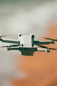 Close-up of a flying drone with blurred background, highlighting modern technology in motion.