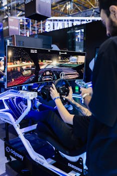 Immersive racing simulator setup with curved monitor at a tech exhibition featuring a dynamic gaming experience.