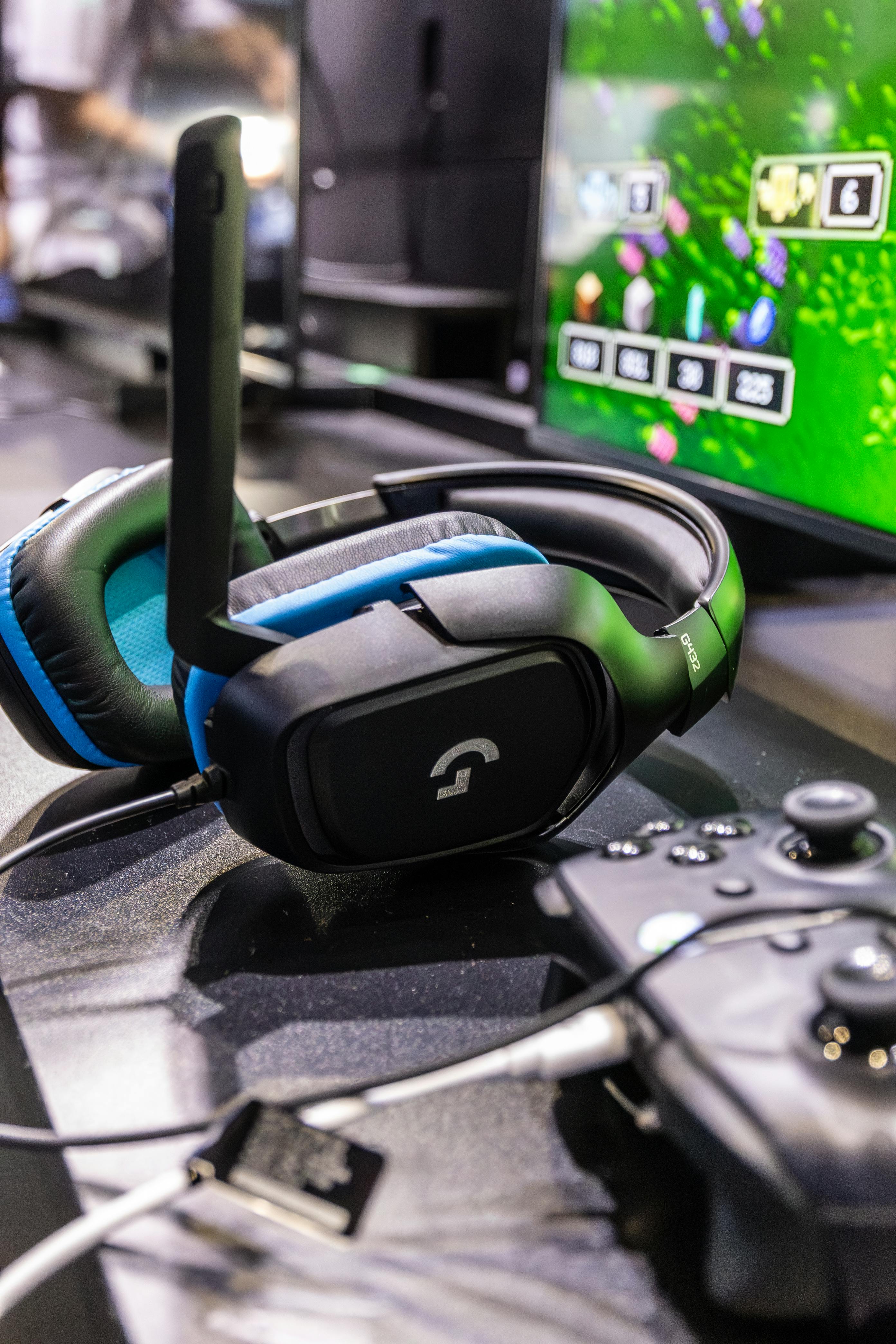 Logitech G432 Gaming Headset Next to a Controller · Free Stock Photo