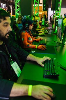 Gamers in cosplay play together at a vibrant tech event, showcasing teamwork and technology.