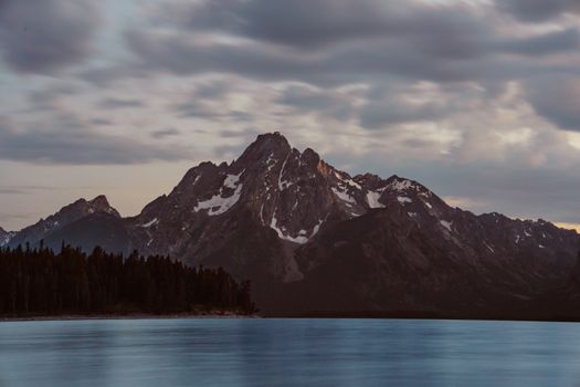 A mountain range is seen from the water