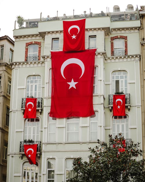 Flags on Wall of Residential Building in Turkey
