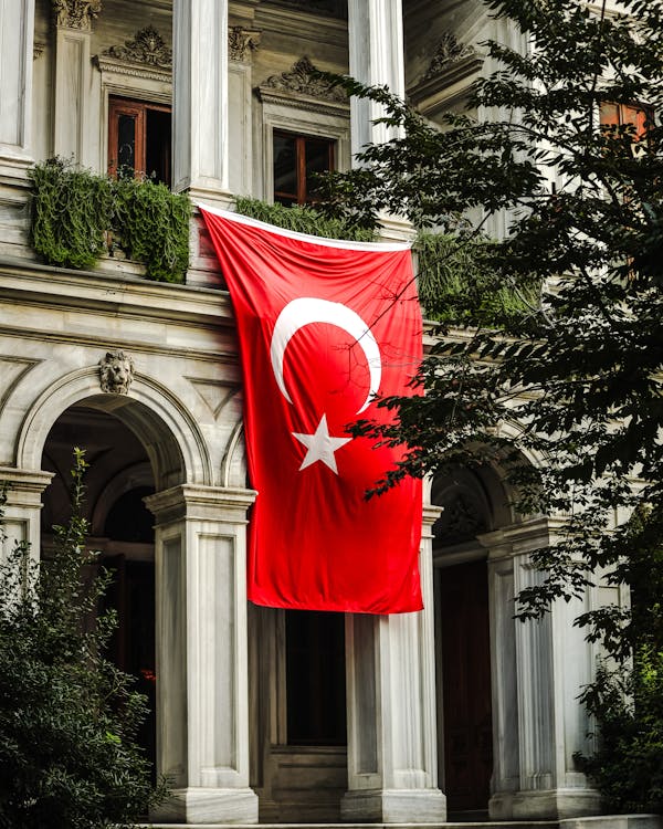 Turkish Flag Hanging on a Building 