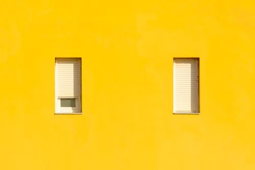 Windows on Yellow Wall