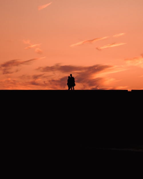 Silhouette of Couple at Dusk
