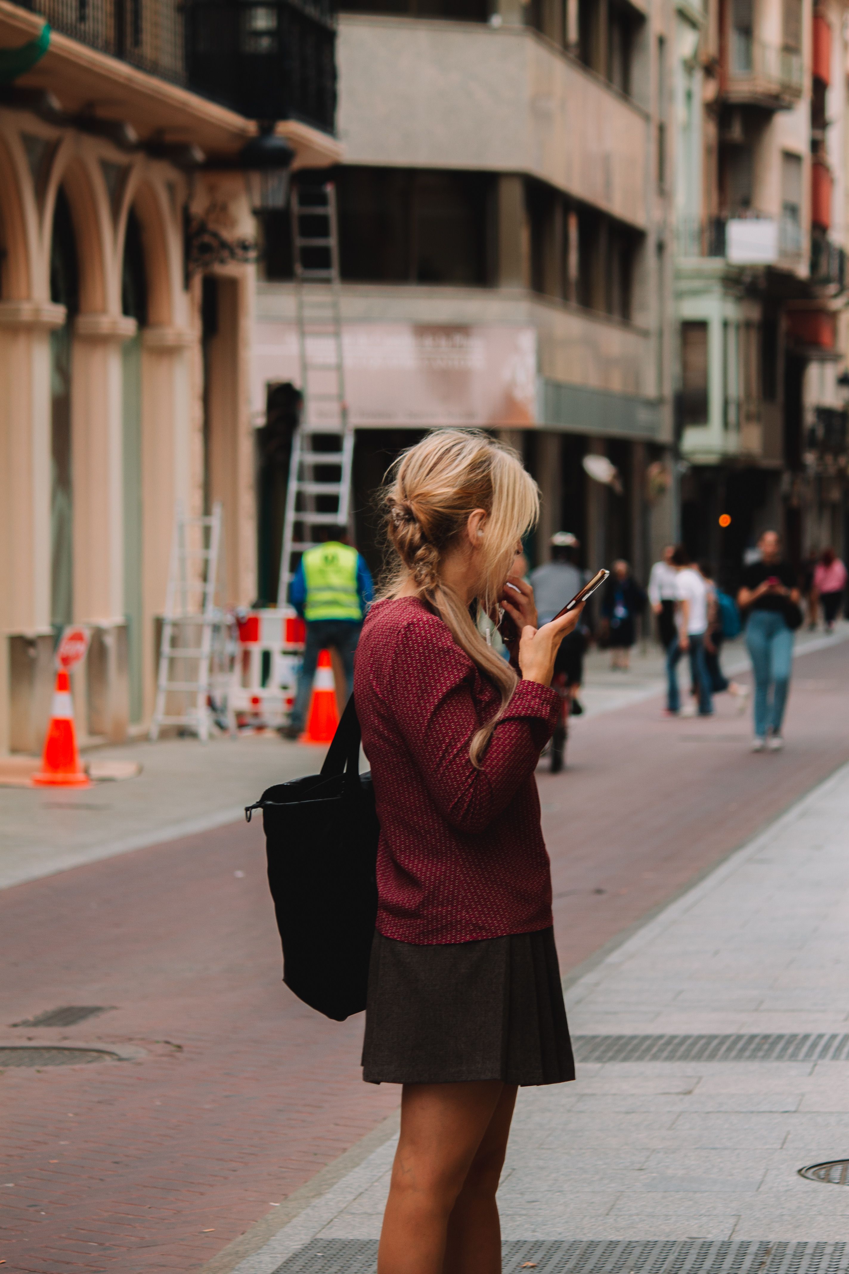 Back View of a Woman Wearing Black Sweater and a Skirt · Free Stock Photo