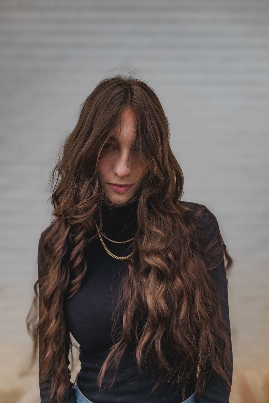 Woman with long wavy dark hair