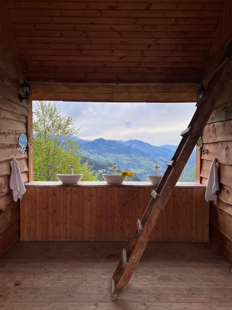 Bathroom In A Wooden Hut In Mountains