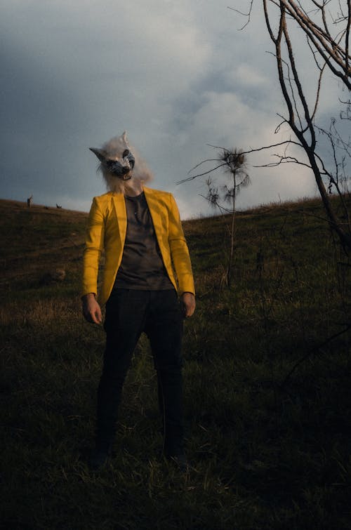 Man in Wolf Mask and Yellow Jacket