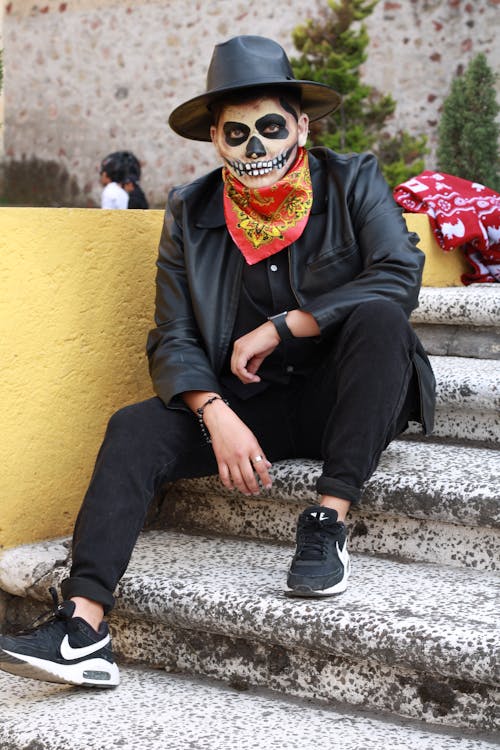 Man Wearing Mexican Costume Sitting on Stairs 