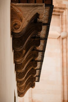 Close-up of an ornate cornice showcasing intricate design in classic architecture.