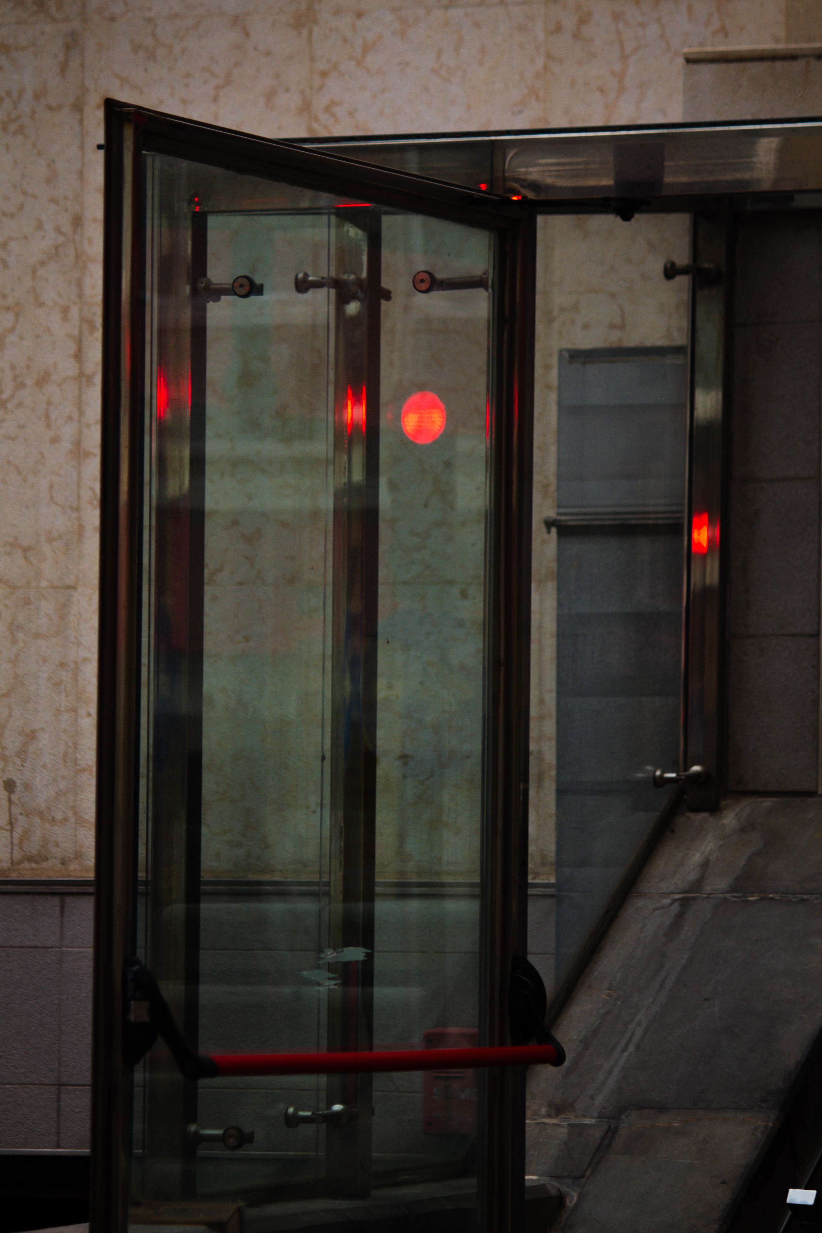 Modern glass entrance door with a metal handle