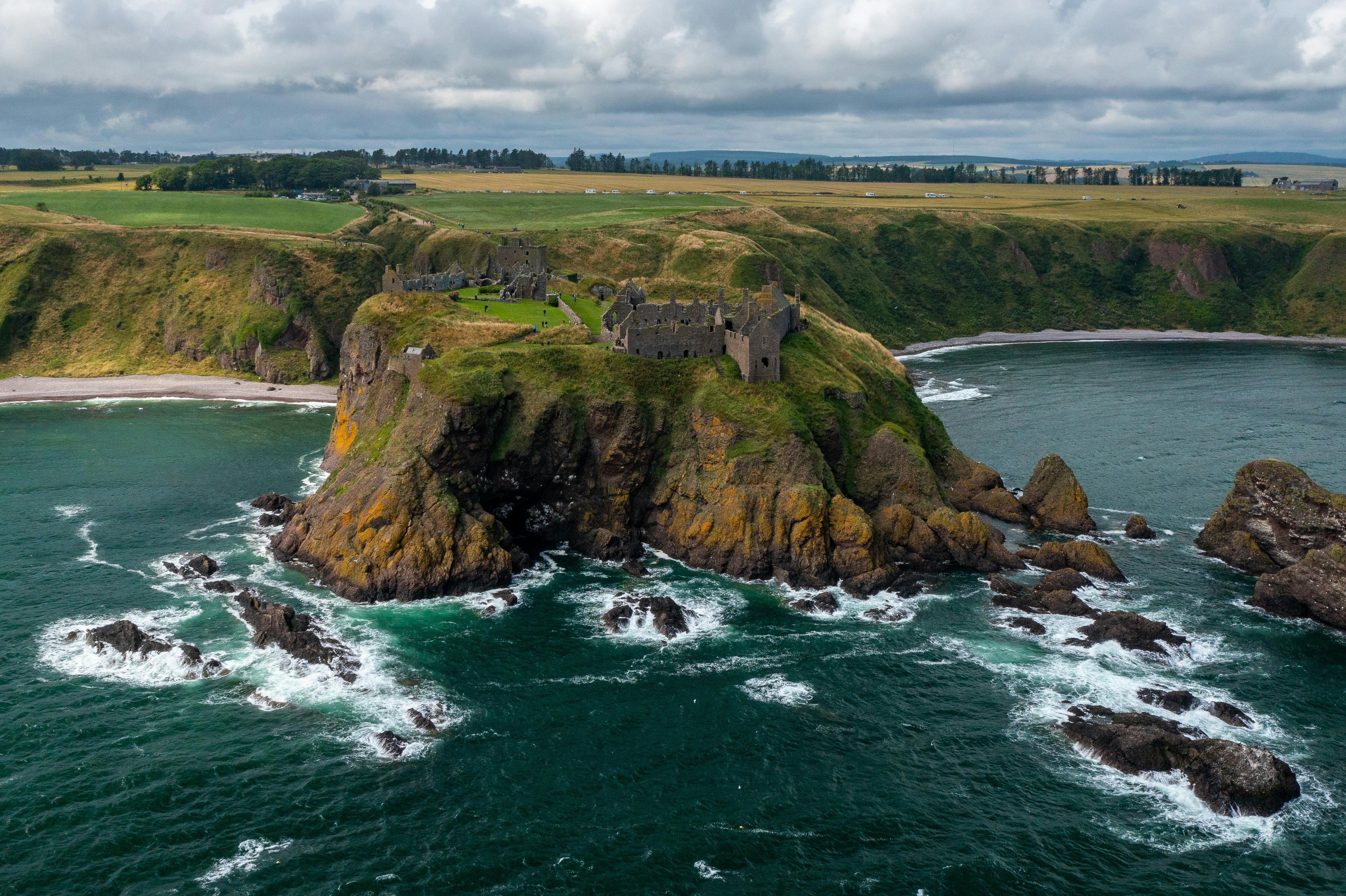 ruins of dunnottar castle on sea shore in scotland