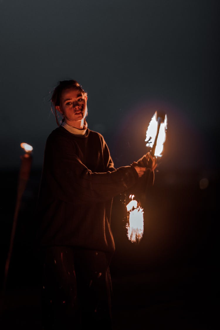 Performer Dancing With Fire At Night