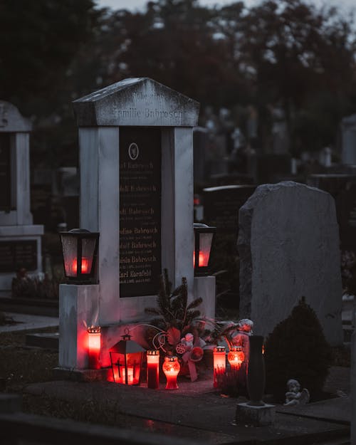 Free Candles by the Grave in the Evening  Stock Photo