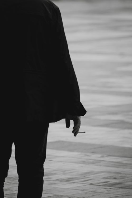 cigarette back Back View of a Man with a Cigarette in Hand · Free Stock Photo