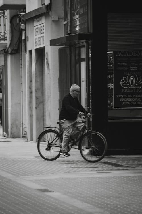 Man on a Bicycle on the Street in City 