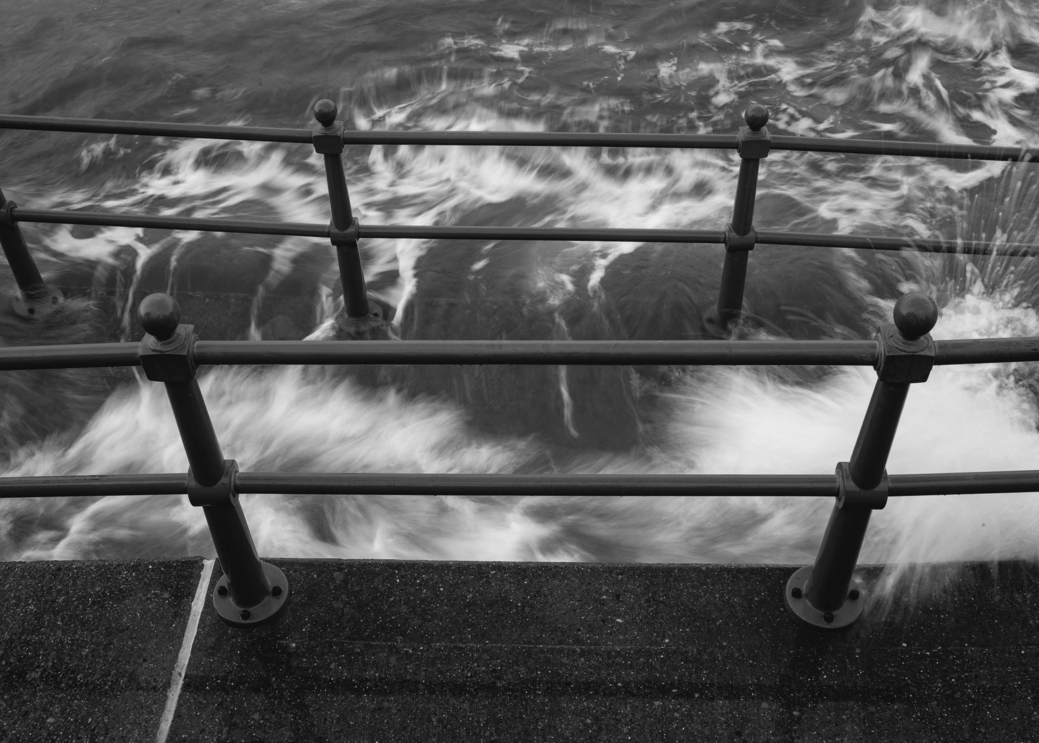 Slumped Against Railing Wave Crashing Against Railing · Free Stock Photo