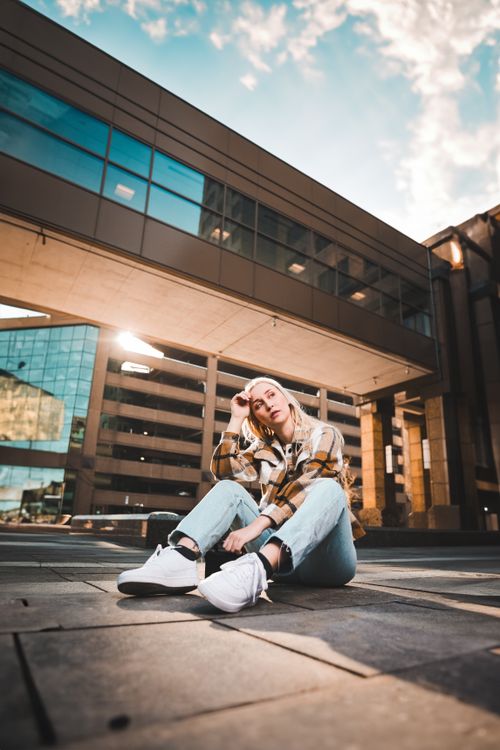 Free Stylish woman posing in downtown Des Moines, showcasing urban fashion trends. Stock Photo