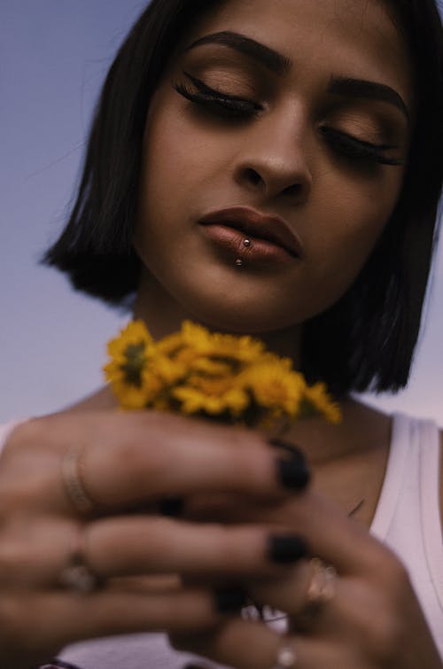 Woman Holding a Bouquet of Flowers 