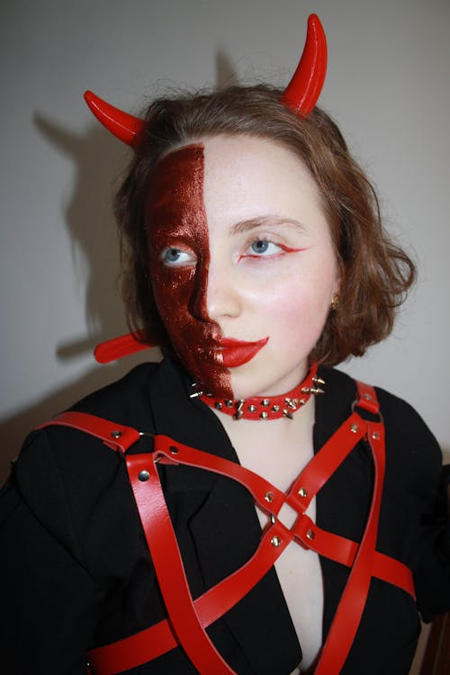 Woman in Devil Costume and Makeup for Halloween