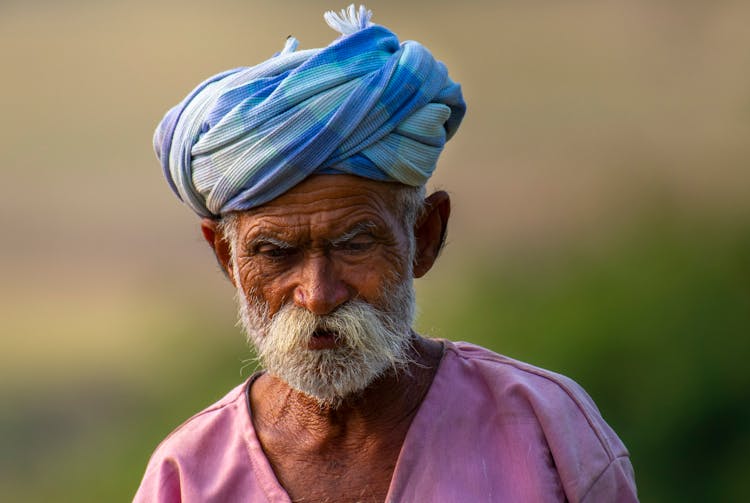 Old Bearded Man In Headwear