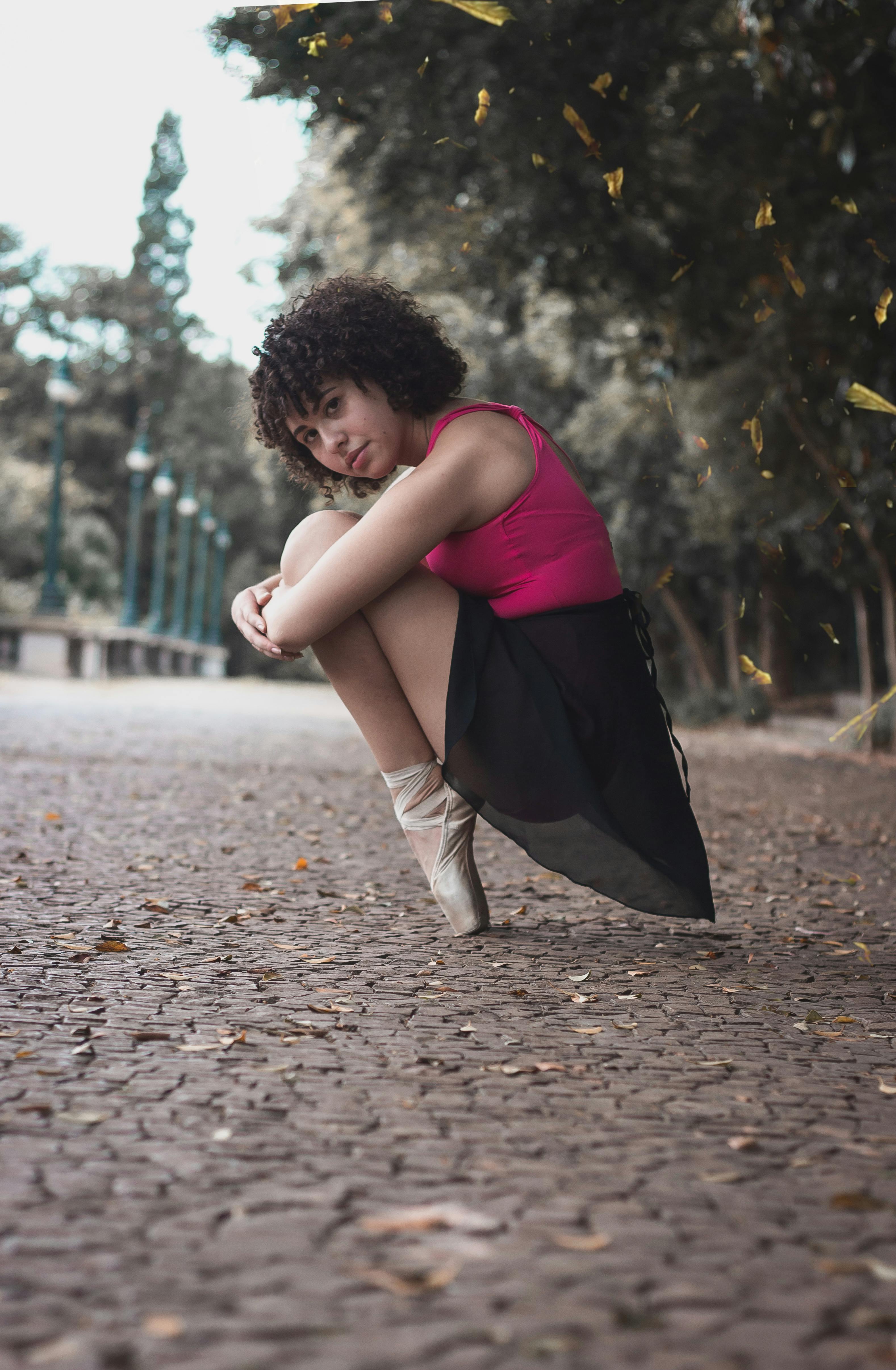 Sitting Ballerina Beside Green and Brown Trees · Free Stock