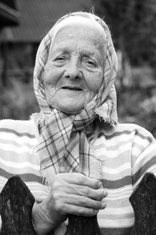 Free Black and White Portrait of a Smiling Elderly Woman  Stock Photo