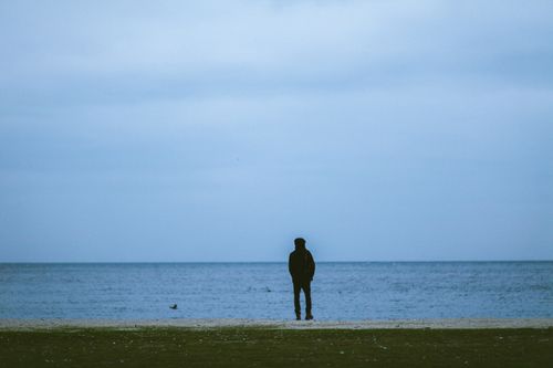 Free Silhouette of a person by the sea at twilight in Istanbul, evoking solitude and introspection. Stock Photo